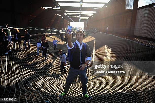 People walk on the net inside the Brazil Pavillon during the closing day of the exh ibition on October 31, 2015 in Milan, Italy.The gates of the...