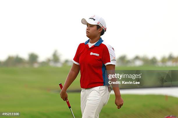 Haru Nomura of Japan reacts after she finished her 18th hole at the final round on Day 7 of Blue Bay LPGA 2015 at Jian Lake Blue Bay golf course on...