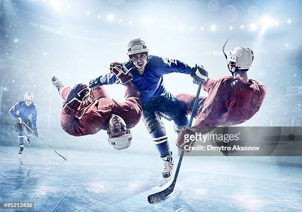 extremely powerful ice hockey player - tackling stockfoto's en -beelden