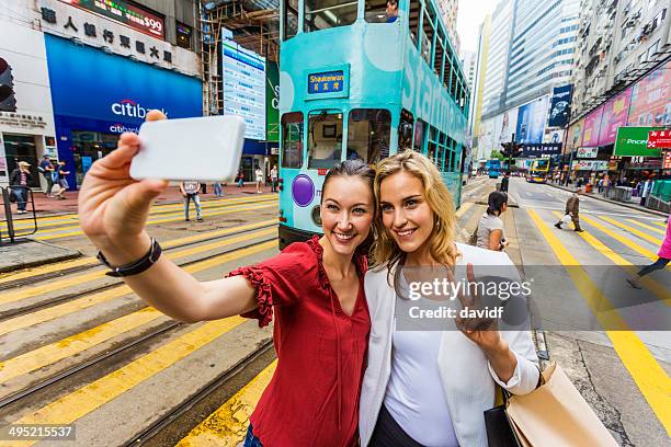 hong kong tram selfie women - eurasian ethnicity stock pictures, royalty-free photos & images