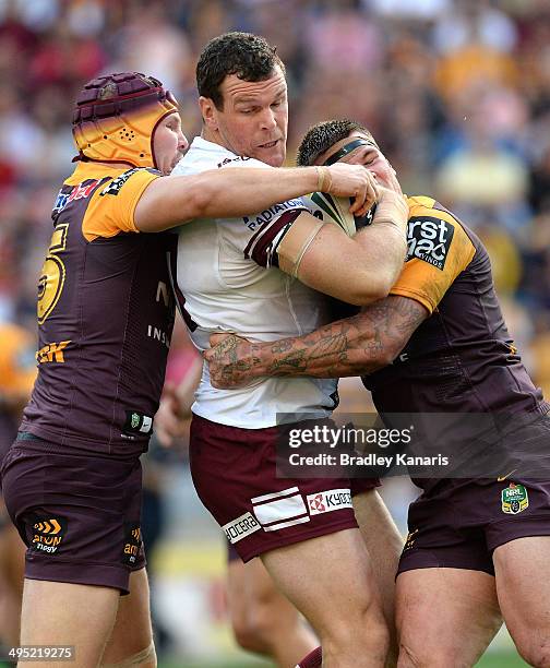 Jason King of the Sea Eagles is tackled during the round 12 NRL match between the Brisbane Broncos and the Manly-Warringah Sea Eagles at Suncorp...