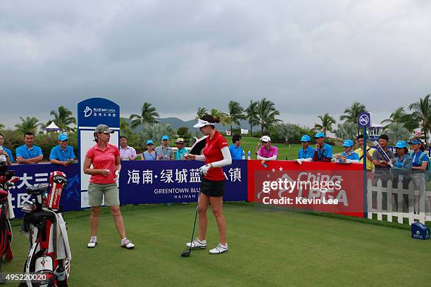 Karine Icher of France chats with Sandra Gal of Germany before tee off at 1st green at final round on Day 7 of Blue Bay LPGA 2015 at Jian Lake Blue...