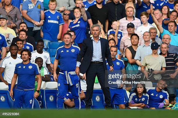 Chelsea manager Jose Mourinho and the Chelsea bench look on as Eden Hazard is fouled during the Barclays Premier League match between Chelsea and...