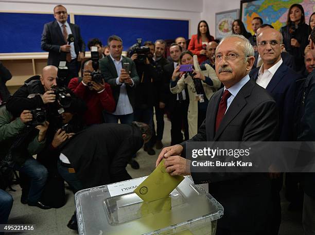 Kemal Kilicdaroglu, leader of the main opposition Republican People's Party casts his vote at a polling station during a general election on November...