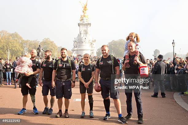 Prince Harry meets with members of the Walking With The Wounded team in the forecourt of Buckingham Palace after their latest endeavour, the Walk Of...