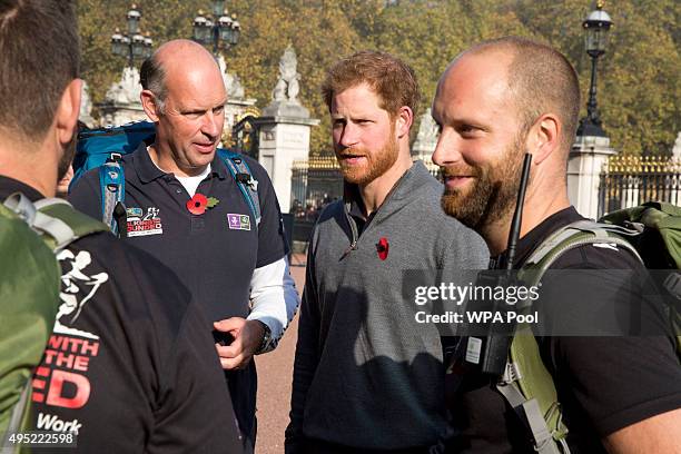 Prince Harry meets with members of the Walking With The Wounded team in the forecourt of Buckingham Palace after their latest endeavour, the Walk Of...