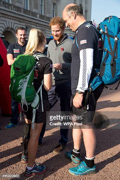Prince Harry meets with members of the Walking With The Wounded team in the forecourt of Buckingham Palace after their latest endeavour, the Walk Of...