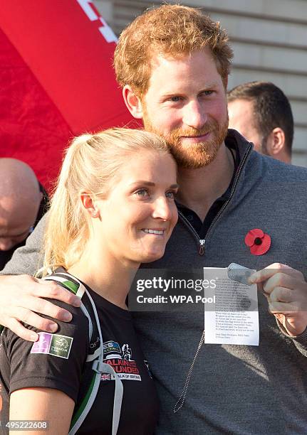 Prince Harry meets with members of the Walking With The Wounded team in the forecourt of Buckingham Palace after their latest endeavour, the Walk Of...