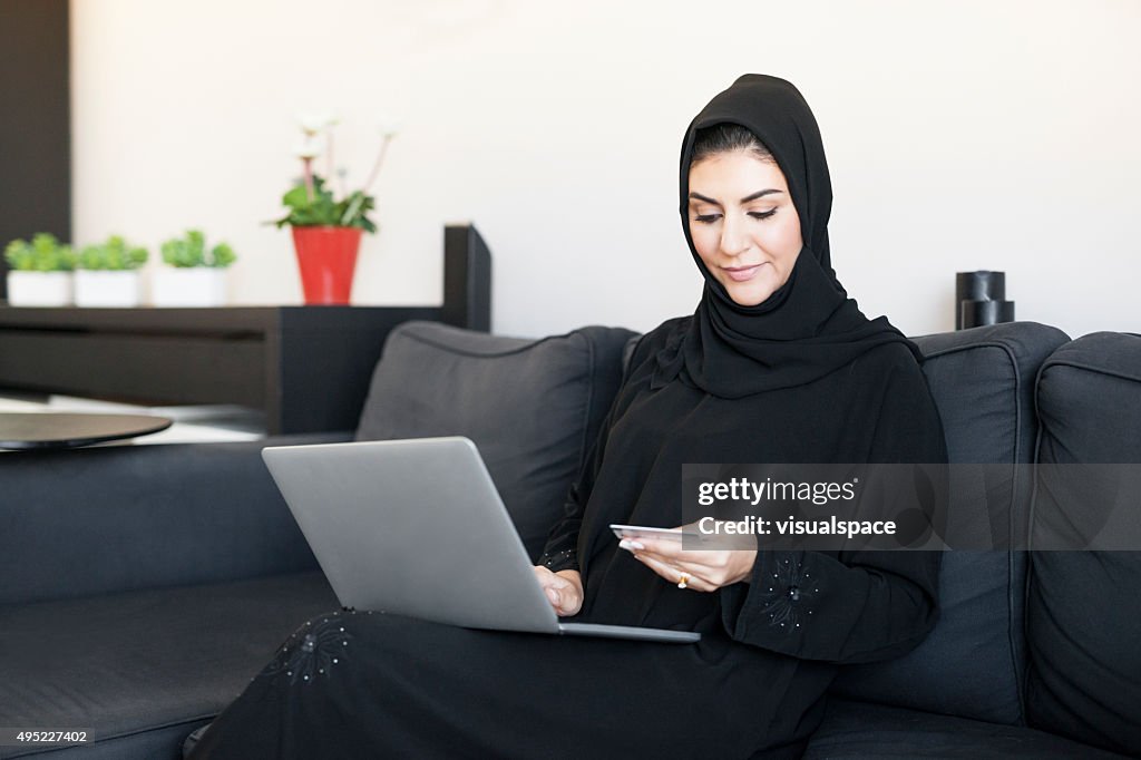 Content Arab Woman Shopping Online Being At Home