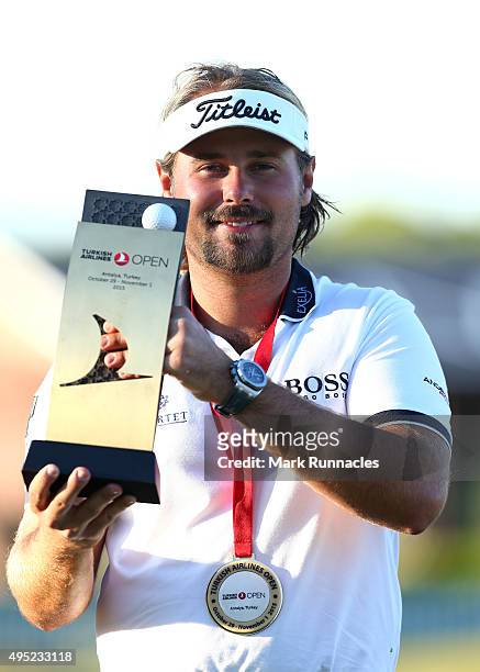 Victor Dubuisson of France winner of the 2015 Turkish Airlines Open with the trophy on the 18th green during the final round of the Turkish Airlines...