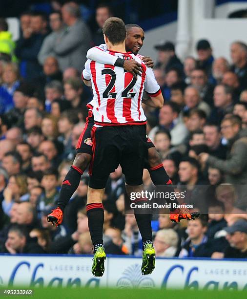 Jermain Defoe of Sunderland celebrates with team mate Sebastian Coates as he scores their first goal during the Barclays Premier League match between...