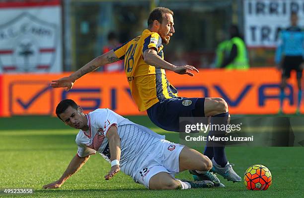 Evangelos Moras of Hellas Verona FC competes for the ball with Kevin Lasagna of Carpi FC during the Serie A match between Carpi FC and Hellas Verona...