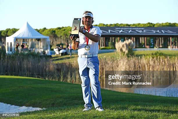 Victor Dubuisson of France winner of the 2015 Turkish Airlines Open with the trophy on the 18th green during the final round of the Turkish Airlines...