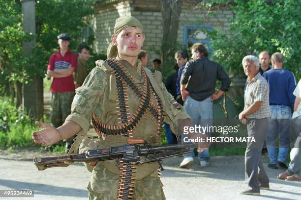 Russian soldier blocks the street where other soldiers try to take control of the hospital of the town of Budennovsk against Chechen rebels 17 June...