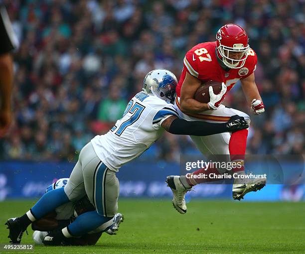 Travis Kelce of the Kansas City Chiefs is tackled by Glover Quin of the Detroit Lions defence during the NFL match between Kansas City Chiefs and...