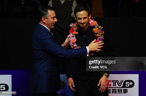 David Gilbert of England poses with a garland after the final match against John Higgins of Scotland on day 8 of Snooker International Championship...