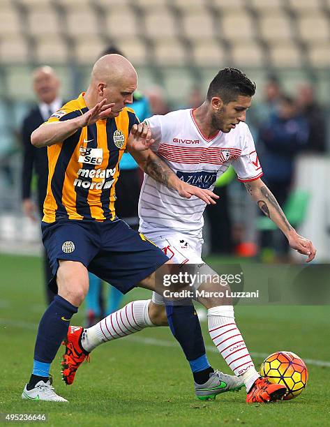 Luca Marrone of Carpi FC is challenged by Emil Hallfredsson of Hellas Verona FC during the Serie A match between Carpi FC and Hellas Verona FC at...