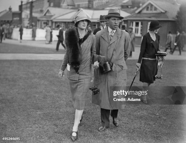 Lord Henry, the 6th Earl of Carnarvon, with his wife Lady Anne Carnarvon, at Newbury Races, 24th September 1926.