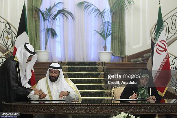 Kuwait's Oil Ministe Ali Saleh Al Omeir and Irans Vice President and Head of Environmental Protection Organization Masoumeh Ebtekar sign agreements...