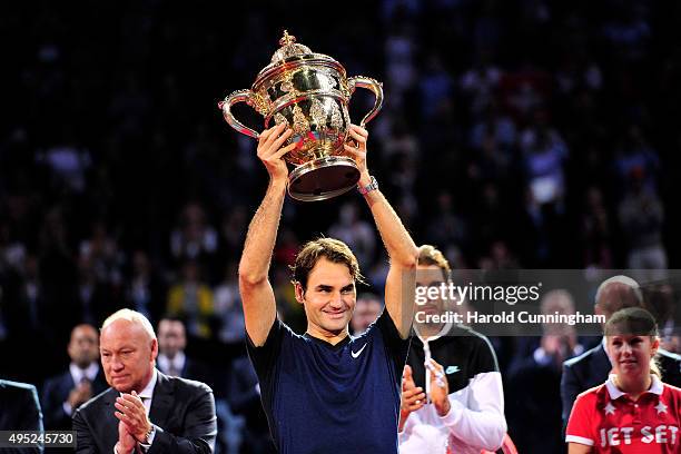 Roger Federer of Switzerland celebrates his victory with the trophy after the Swiss Indoors ATP 500 Final against Rafael Nadal of Spain at St...