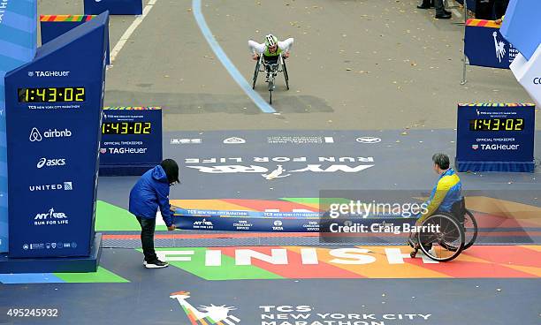 Tatyana McFadden of the United States approaches the finish line to win the Women's Professional Wheelchair Division at TAG Heuer Official Timekeeper...