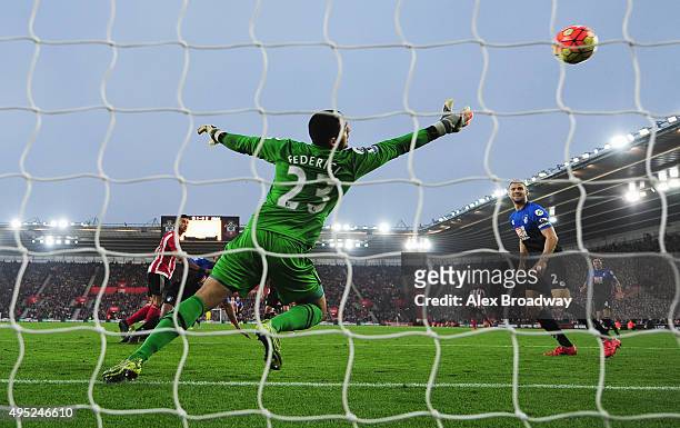 Graziano Pelle of Southampton heads the ball past goalkeper Adam Federici of Bournemouth to score their second goal during the Barclays Premier...