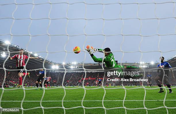 Steven Davis of Southampton shoots past goalkeper Adam Federici of Bournemouth to score their first goal during the Barclays Premier League match...