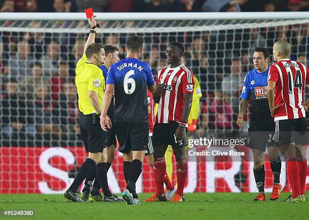 Victor Wanyama of Southampton is shown a red card by referee Craig Pawson and is sent off during the Barclays Premier League match between...