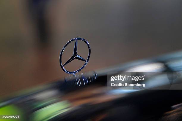 The Mercedes-Benz logo hood ornament stands on a Mercedes-Benz S class S350 automobile, manufactured by Daimler AG, at the Auto Mobil International...