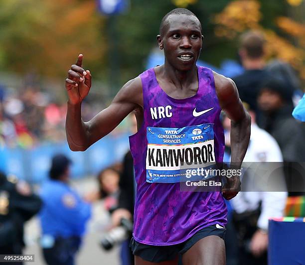 Geoffrey Kamworor of Kenya crosses the finish line in second place during the TCS New York City Marathon on November 1, 2015 in New York City.