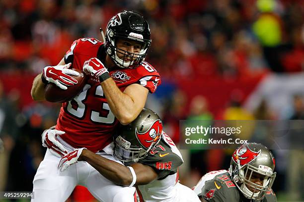 Jacob Tamme of the Atlanta Falcons makes a catch against Alterraun Verner of the Tampa Bay Buccaneers during the first half at the Georgia Dome on...