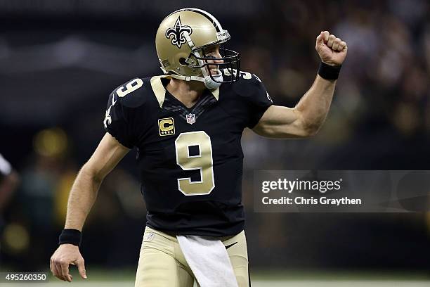 Drew Brees of the New Orleans Saints celebrates a touchdown during the second quarter of a game against the New York Giants at the Mercedes-Benz...