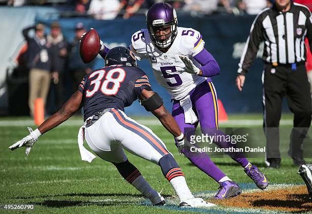 Quarterback Teddy Bridgewater of the Minnesota Vikings carries the football against Adrian Amos of the Chicago Bears in the first quarter at Soldier...