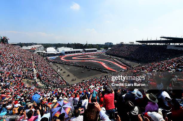 Nico Rosberg of Germany and Mercedes GP leads Lewis Hamilton of Great Britain and Mercedes GP, Daniil Kvyat of Russia and Infiniti Red Bull Racing...