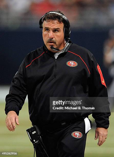 Head coach Jim Tomsula of the San Francisco 49ers walks along the sideline in the first quarter against the St. Louis Rams at the Edward Jones Dome...