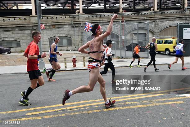 Man wearing Union Jack shorts runs with other participants during the TCS New York City Marathon in New York on November 1, 2015. AFP PHOTO/JEWEL...