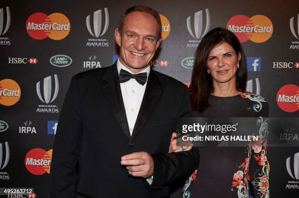 Former South Africa rugby captain Francois Pienaar and his wife Nerine pose on arrival at the World Rugby Awards in London on November 1, 2015.