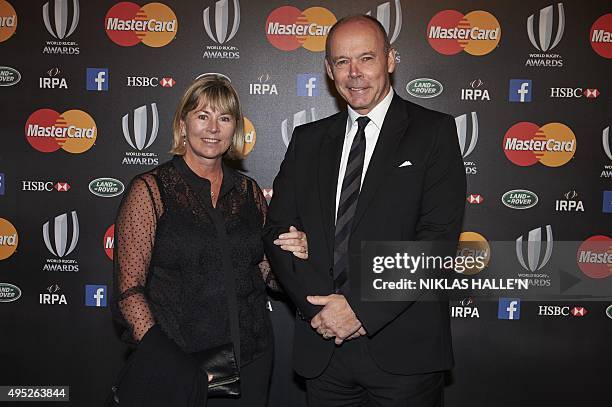 Former England rugby coach Sir Clive Woodward and his wife Jayne Williams pose on arrival at the World Rugby Awards in London on November 1, 2015....