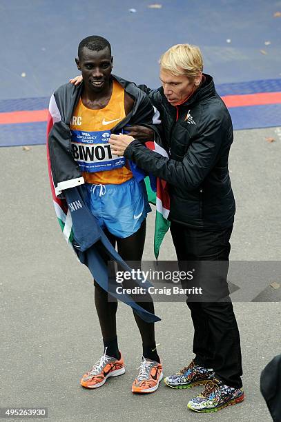 Men's winner Stanley Biwott of Kenya and Peter Ciaccia, President of Events for the New York Road Runners and Race Director of TCS New York City...