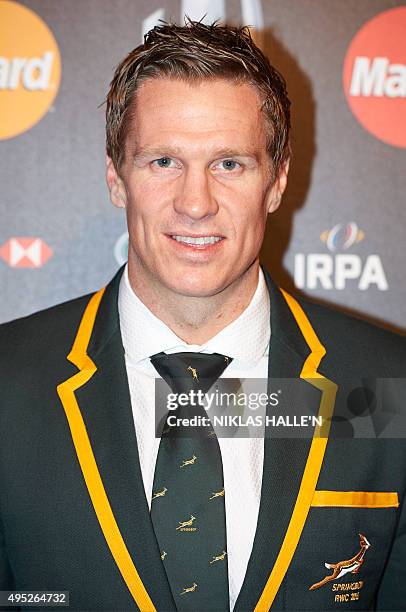Former South Africa captain Jean de Villiers poses on arrival at the World Rugby Awards in London on November 1, 2015. / AFP PHOTO / NIKLAS HALLE'N