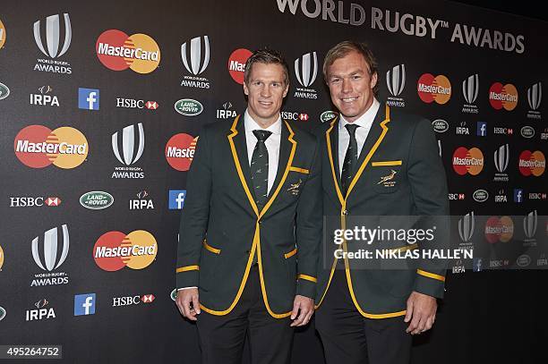 Former South Africa captain Jean de Villiers and flanker Schalk Burger pose on arrival at the World Rugby Awards in London on November 1, 2015. AFP...