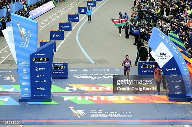 Lelisa Desisa of Ethiopia crosses the finish line in 3rd place in the Pro Men's division at TAG Heuer Official Timekeeper and Timepiece of 2015 TCS...
