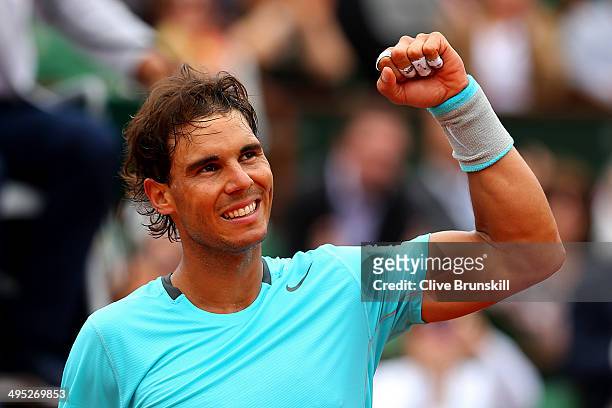 Rafael Nadal of Spain celebrates victory in his men's singles match against Dusan Lajovic of Serbia on day nine of the French Open at Roland Garros...