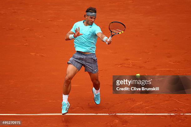Rafael Nadal of Spain returns a shot in his men's singles match against Dusan Lajovic of Serbia on day nine of the French Open at Roland Garros on...