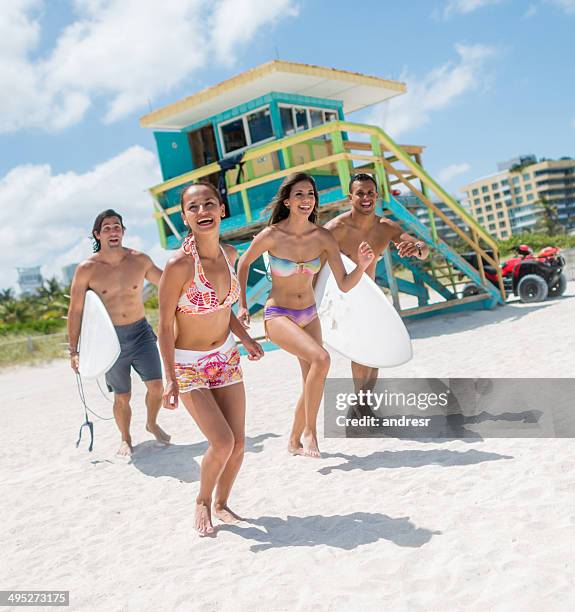friends on summer holidays - miami beach stock pictures, royalty-free photos & images