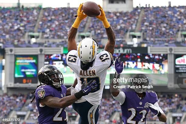 Wide receiver Keenan Allen of the San Diego Chargers catches a touchdown pass in front of Kendrick Lewis and Jimmy Smith of the Baltimore Ravens...