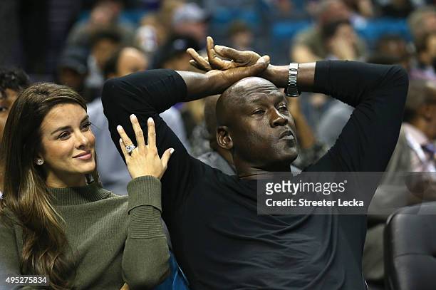 Yvette Prieto and her husband and owner of the Charlotte Hornets, Michael Jordan, watch on during their game against the Atlanta Hawks at Time Warner...