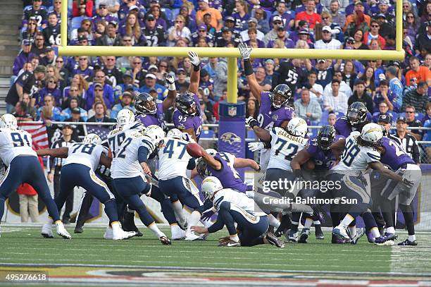 Baltimore Ravens special teams player Asa Jackson blocks an extra point during the second quarter on Sunday, Nov. 1 at M&T Bank Stadium in Baltimore.