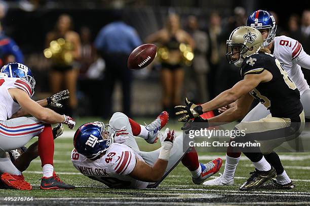 New Orleans Saints wide receiver Willie Snead picks up a fumble against the New York Giants at Mercedes-Benz Superdome on November 1, 2015 in New...