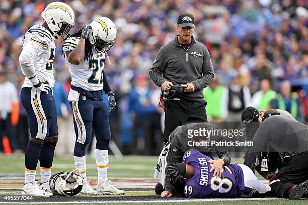 Wide receiver Steve Smith of the Baltimore Ravens is tended to by medial staff after being injured in the third quarter against the San Diego...